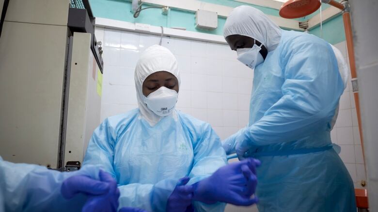 People wear surgical scrubs in a health-care setting.