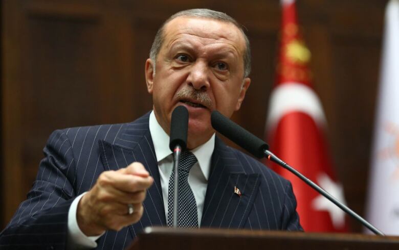  Turkish President and leader of Turkey's ruling Justice and Development (AK) Party Recep Tayyip Erdogan addresses the crowd during his party's parliamentary group meeting at the Grand National Assembly of Turkey (GNAT) in Ankara, on October 02, 2018.  