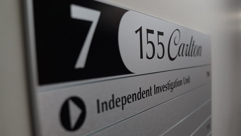 A sign on door for the Independent Investigation Unit of Manitoba is shown.