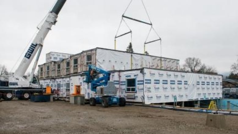 modular housing project with crane