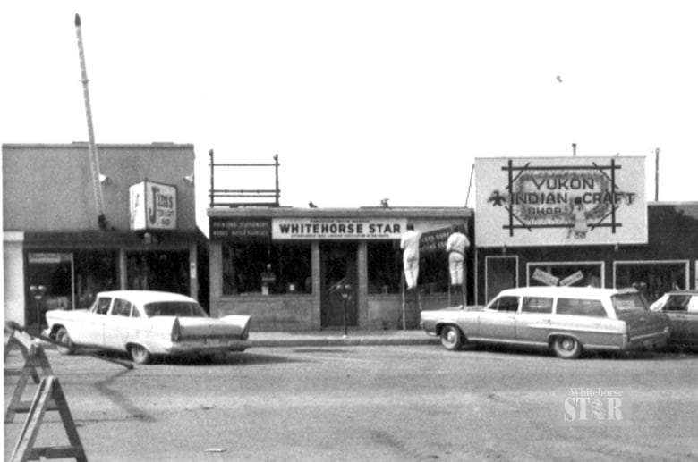 Black and white photo of storefronts