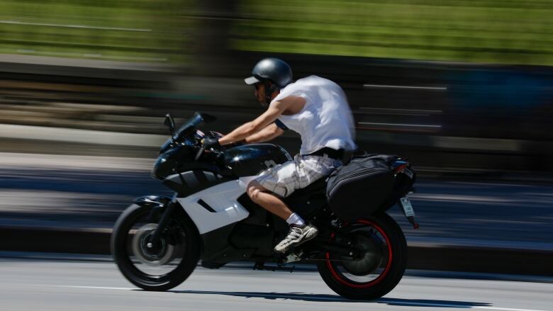 man rides motorbike