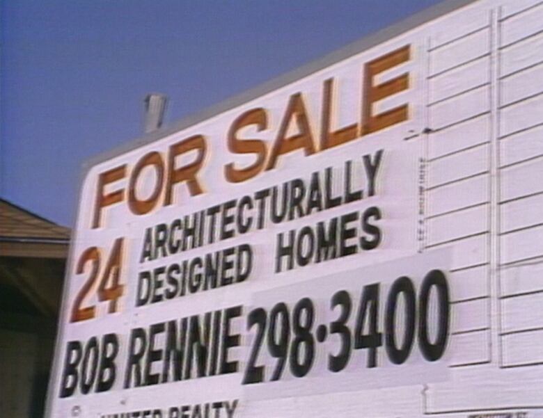 A real estate sign advertising homes for sale