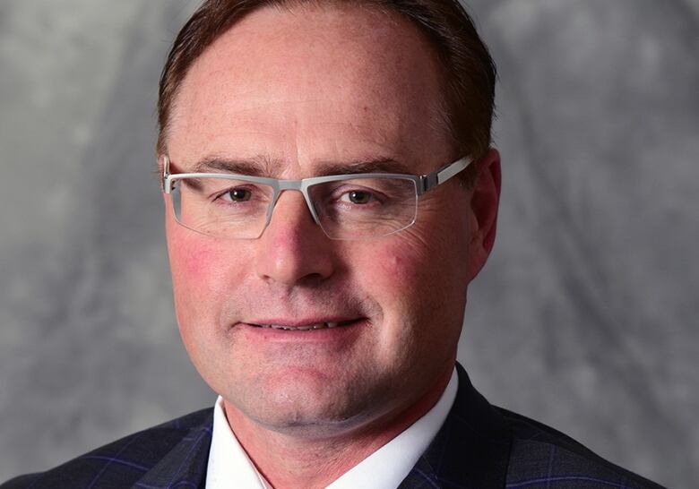 Kyle McIntyre, commissioner of the Saskatchewan Junior Hockey League, posing for a headshot. 