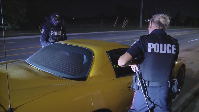 Peel Police pull over a yellow vehicle