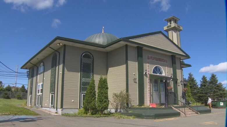 A mosque is pictured on a summer's day.