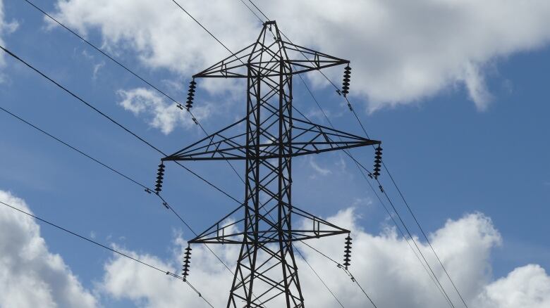 A hydro tower against a blue sky.