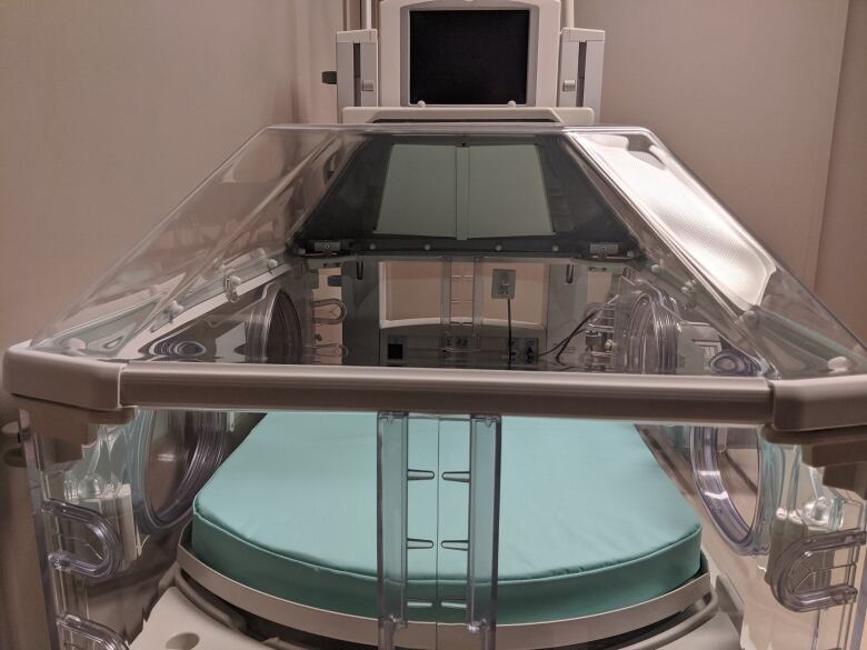 Baby-sized hospital bed. 