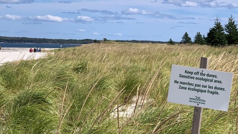 A province of Nova Scotia sign on a sand dune says 