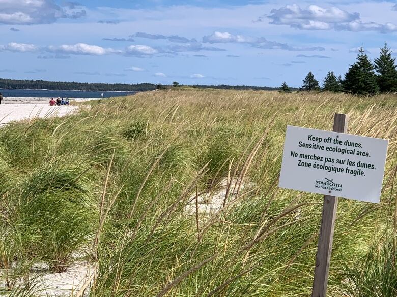 A province of Nova Scotia sign on a sand dune says 