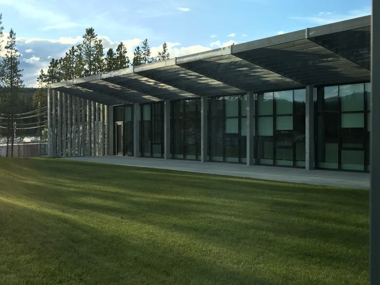 A building with grass in the foreground.