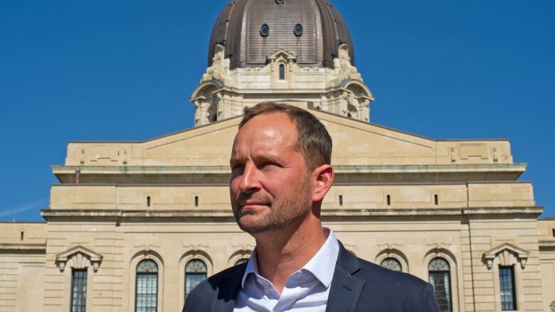 Saskatchewan NDP Leader Ryan Meili in front of the Saskatchewan Legislative Building.