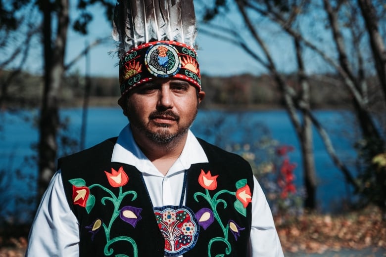 Man wearing Indigenous head dress