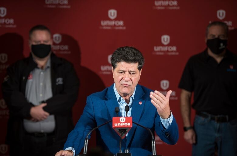 A man stands at a podium.