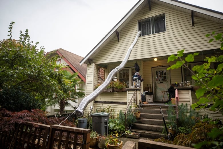 A chute descends from the top floor of a single-family house in Vancouver during Halloween.