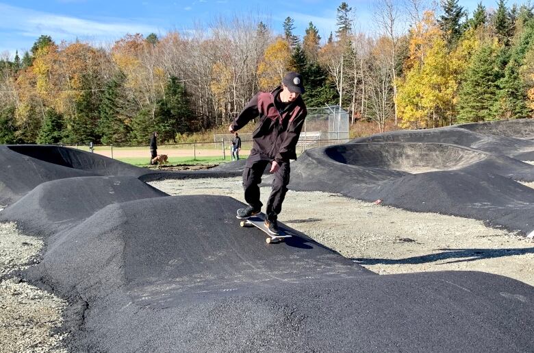 A skateboarder tests out the new pump track in Dartmouth, N.S. 