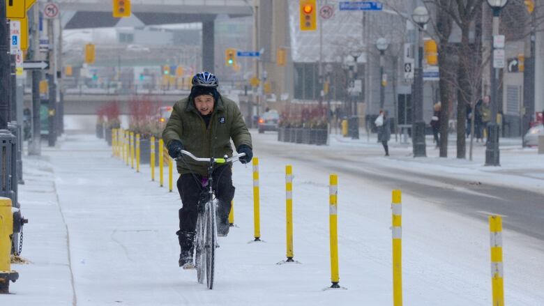 A cyclist on a snowy street.