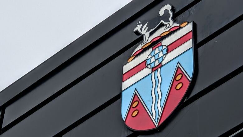 The Yukon coat of arms attached to the Yukon legislative building in Whitehorse 