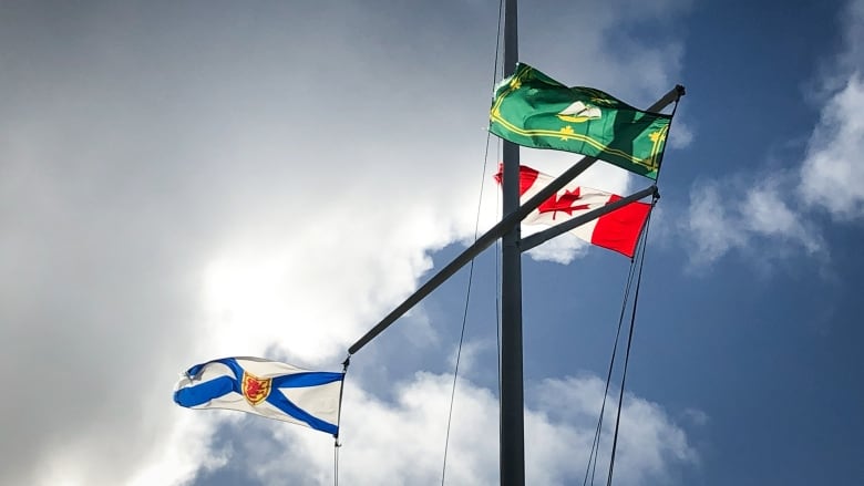 The flags for CBRM, Nova Scotia and Canada on masts.