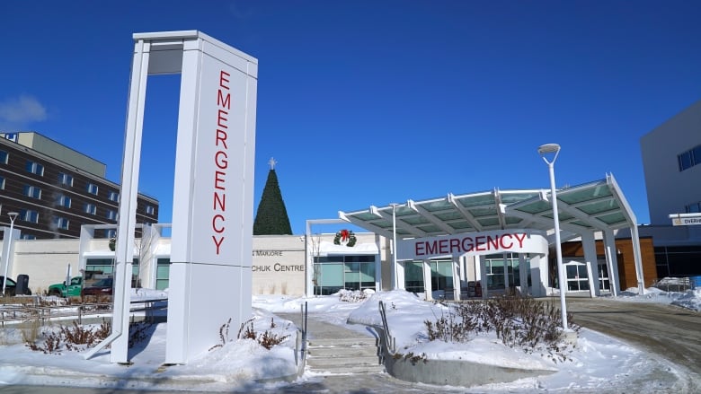 Exterior of emergency room entrance, with snow on the ground.