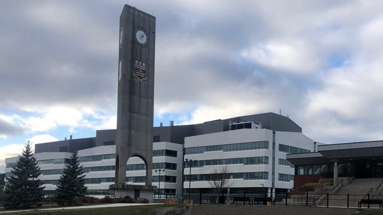 Clock tower and University Centre from the outside on a cloudy day at Memorial University