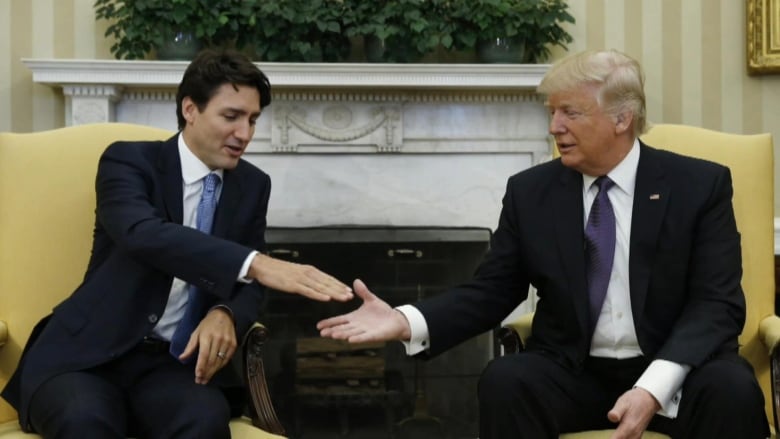 Justin Trudeau and Donald Trump shake hands.