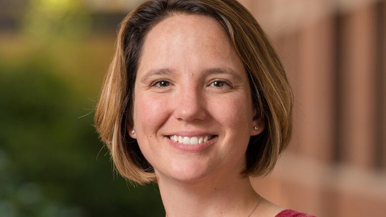 Headshot of a woman with short hair. 