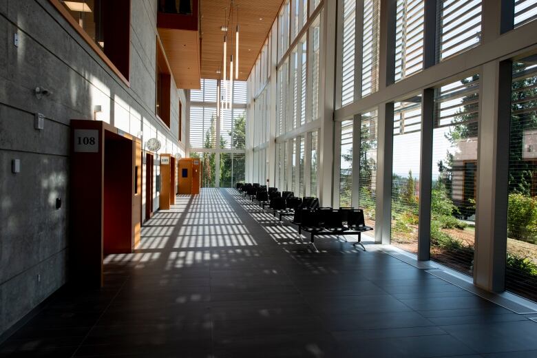 A hall of a courthouse, with entrances to multiple courtrooms.