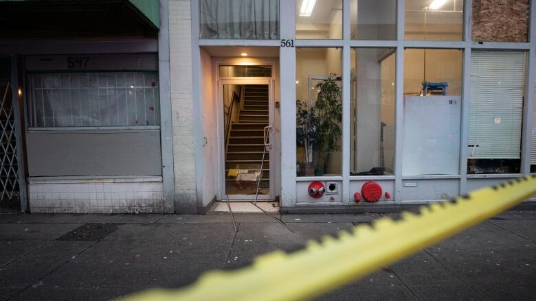 Broken glass and blood were visible behind police tape at 561 East Hastings Street in Vancouver on Jan. 5, 2020.