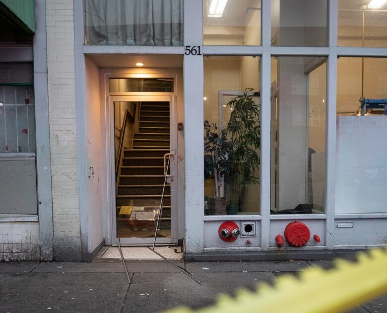 Broken glass and blood were visible behind police tape at 561 East Hastings Street in Vancouver on Jan. 5, 2020.