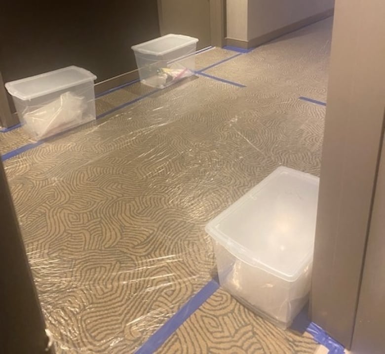 The hallway outside Mitch Beaulieu's hotel room at the federally designated quarantine site near the Calgary airport. Food and supplies are left in containers outside guests' rooms.