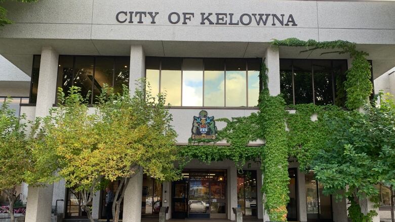 A large building marked 'City of Kelowna', with a municipal symbol just beneath it.