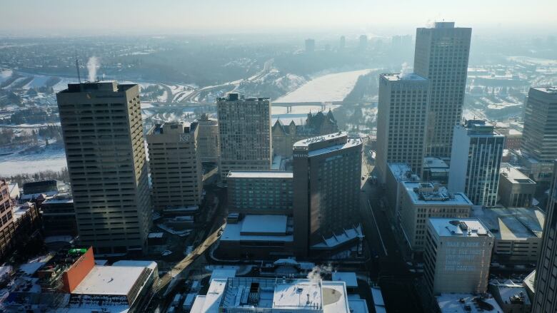 Aerial shot of downtown Edmonton skyscrapers in winter snow.