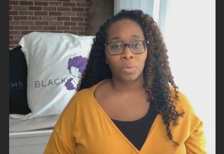 A headshot of Tanya Hayles, a mother of a 10 year old and founder of the group Black Moms Connection