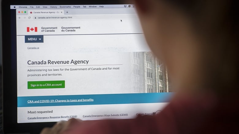 A computer screen displays the Canada Revenue Agency website.