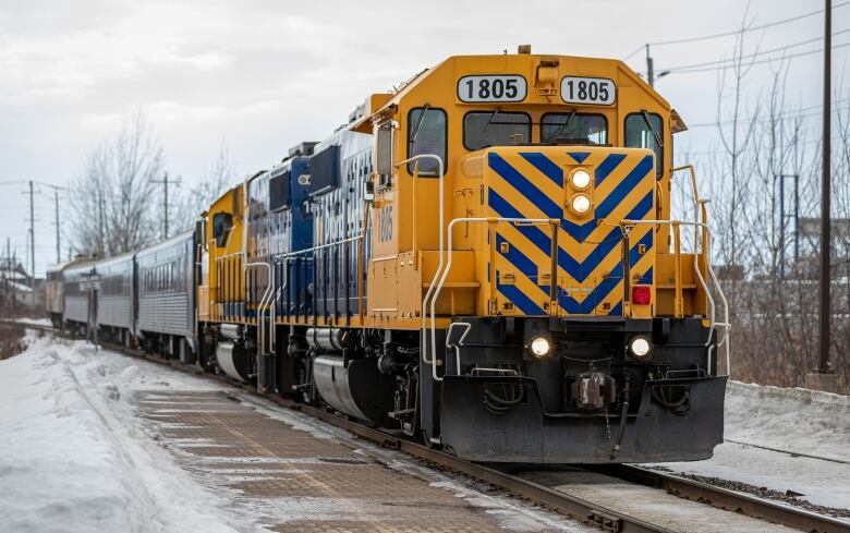 A yellow and blue locomotive. 