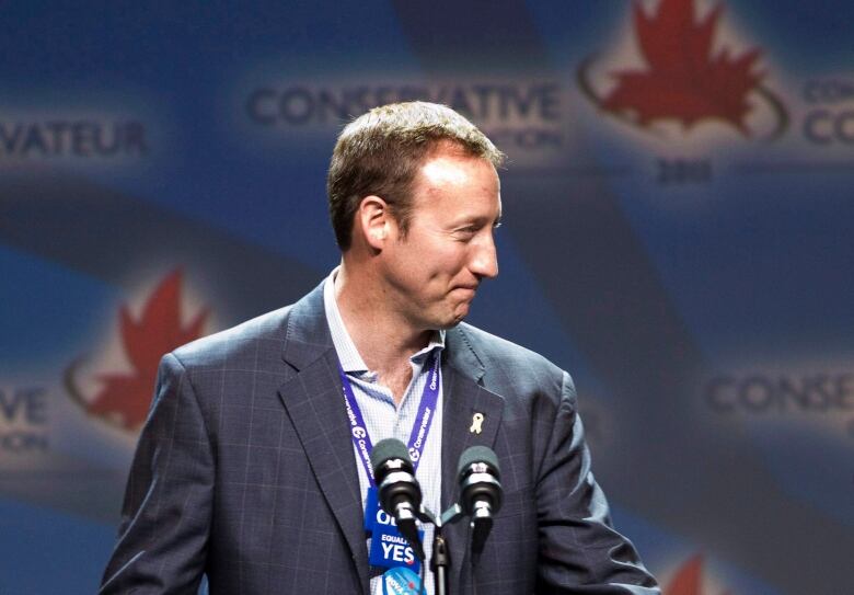 Peter MacKay shown standing at a podium