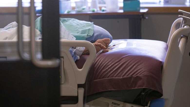 A pair of feet in a hospital bed