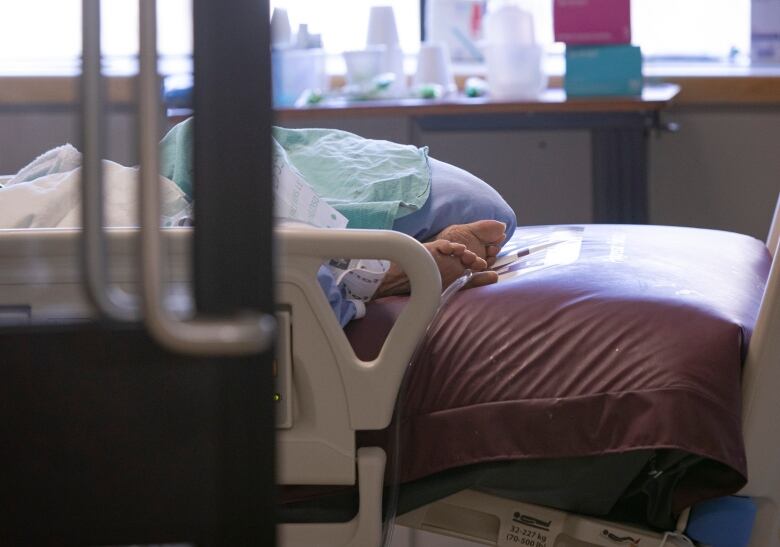 A pair of feet in a hospital bed