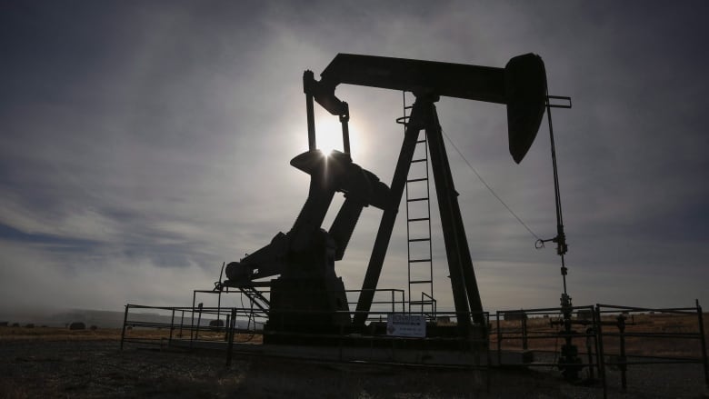 A pumpjack works at a wellhead on an oil and gas installation near Cremona, Alta., Saturday, Oct. 29, 2016. Higher oil prices in the wake of a U.S. air strike in Iraq that killed a top Iranian general are driving up share prices for Canadian energy companies and threatening higher fuel prices for consumers in Canada. 