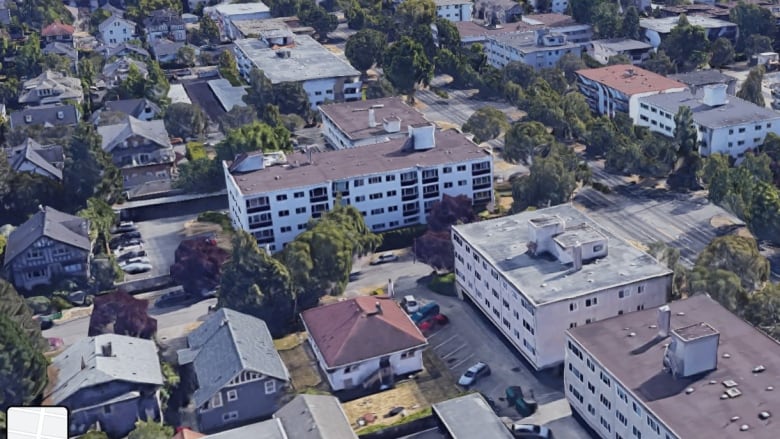 A number of flat buildings along a street in Victoria.