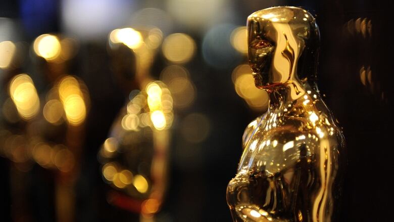 A close up image of golden statuettes is shown. 