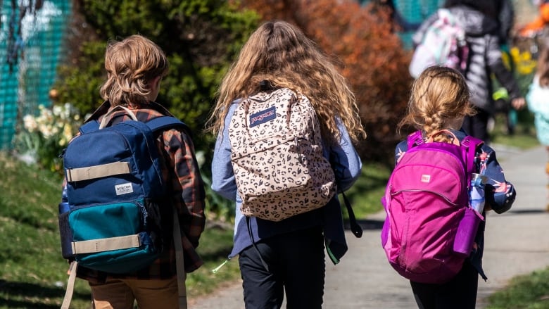 Students are pictured after school at Van Horne Elementary school in Vancouver, British Columbia on Monday, April 12, 2021. 