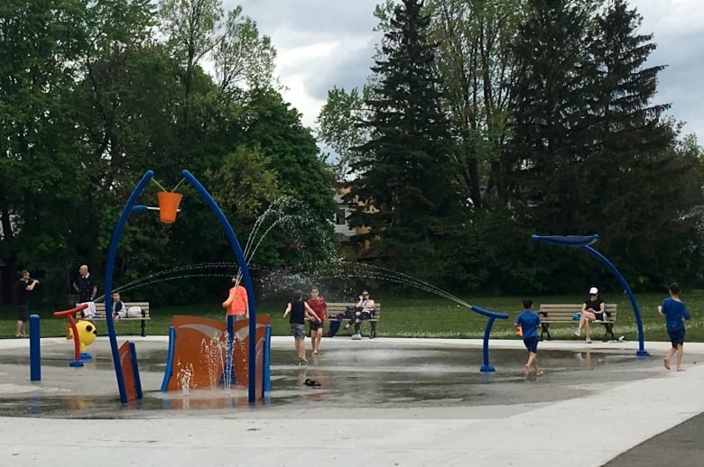 Children play at a splash pad at Clairlea Park in Scarborough.