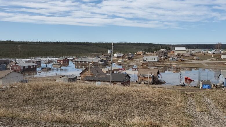 The roads of a small town are seen flooded with water.