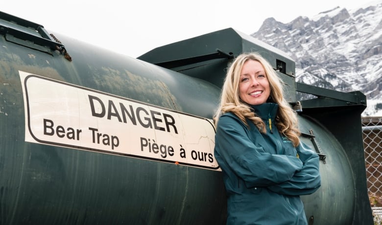 Close-up of Kim Titchener in front of a bear trap.