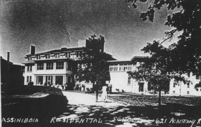 A black and white photo shows a building and is labelled 