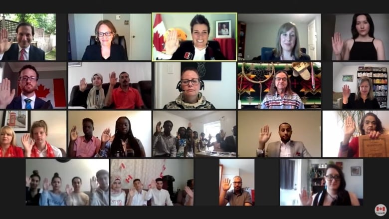 Several people take the oath of citizenship on a videoconference call.