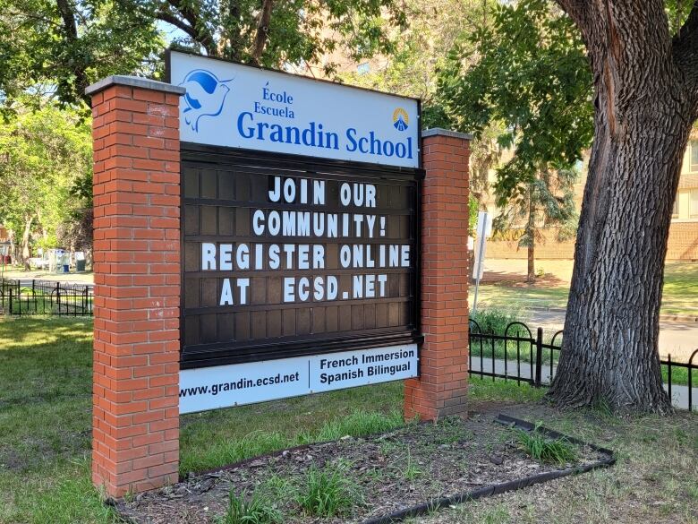 A former school building sign shows the name Grandin.