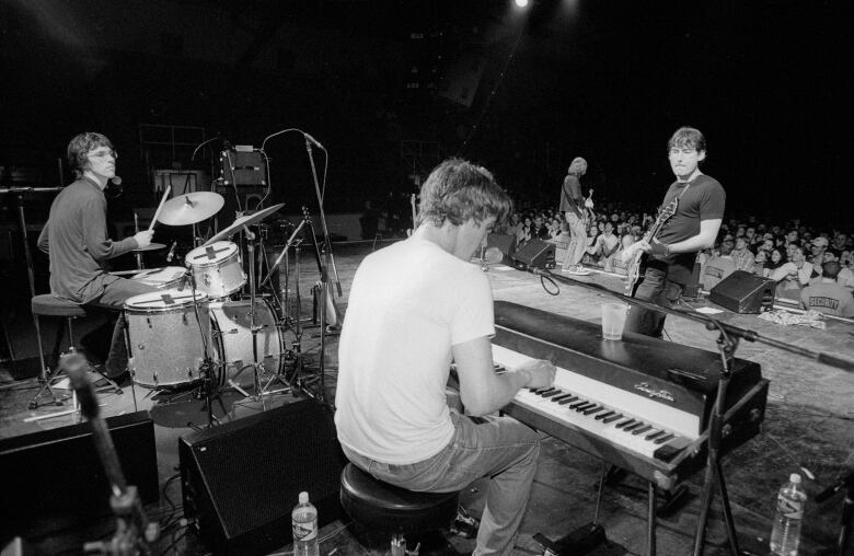 A black and white photo shows Canadian rock band Sloan performing in an undated photo from the One Chord to Another era. The band released that album in 1996.